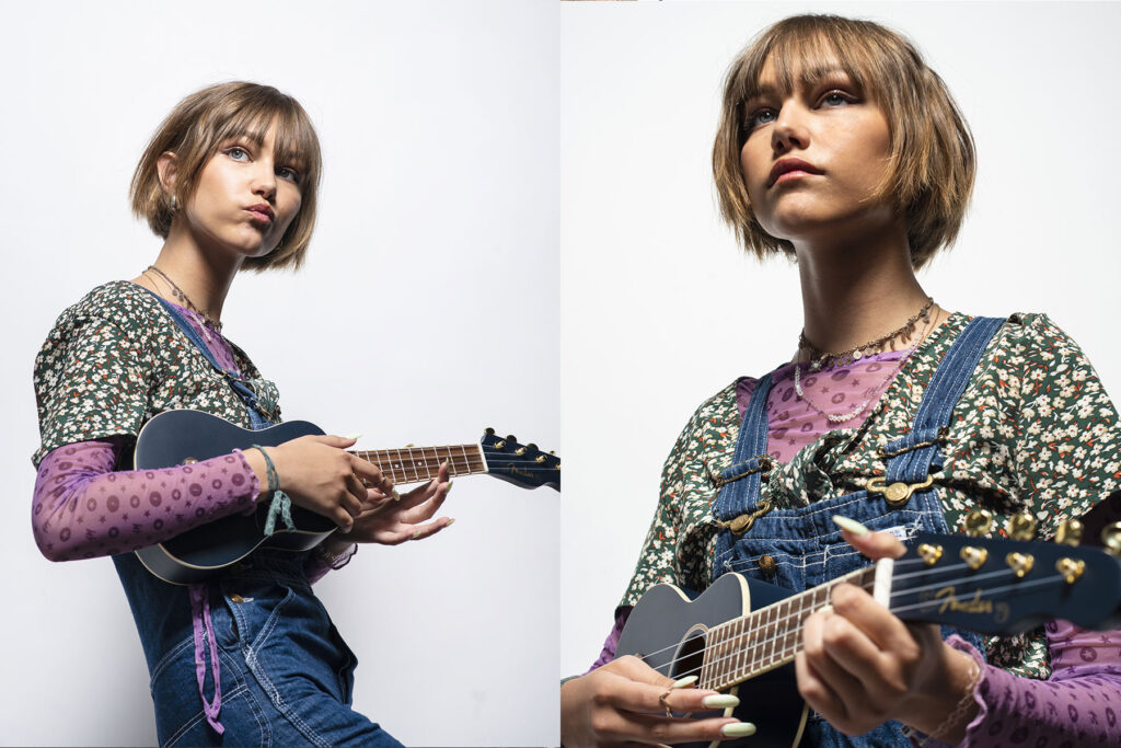 World famous Grace Vanderwaal, a musical virtuoso, poses on a white background for a portrait session in Brooklyn, NY with her ukulele. The photo shoot was produced by Unrivaled, a NYC base production company and photographed by Jonathan Hanson.