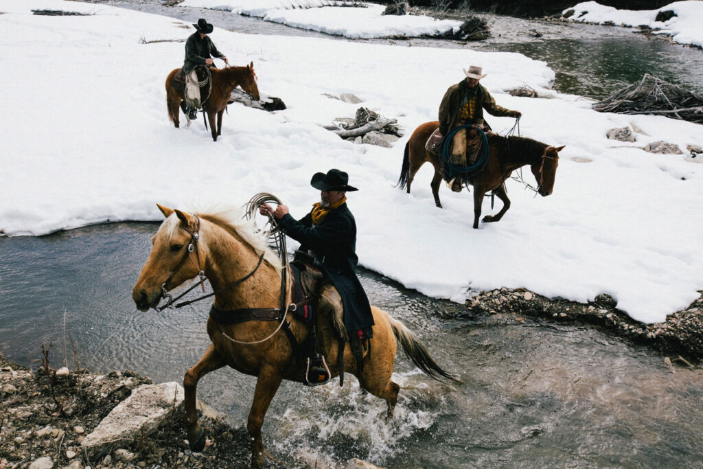 Ranchers in the snowy wilderness, photographed by Travis Gillett.
