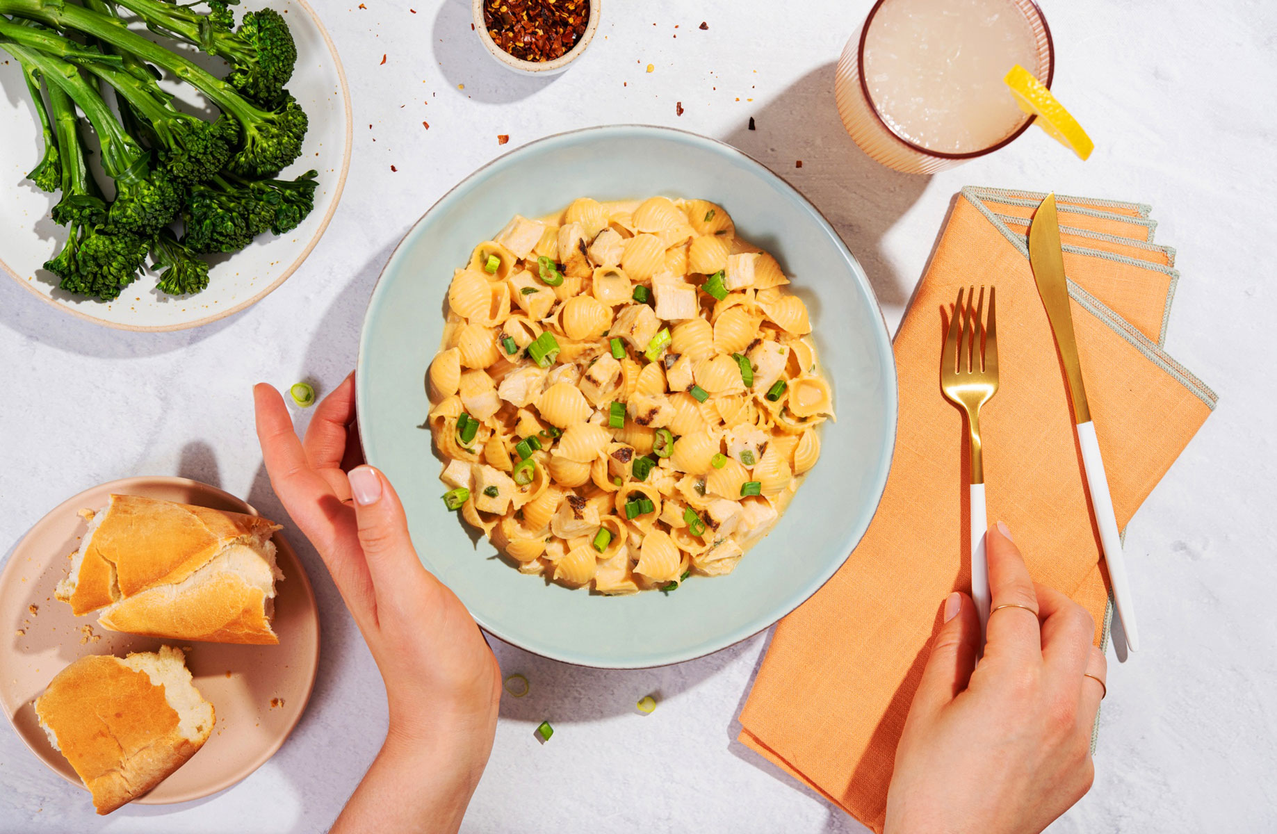 Plates of pasta and veggies, photographed from overhead for Cadence Kitchen by Rebecca Peloquin.
