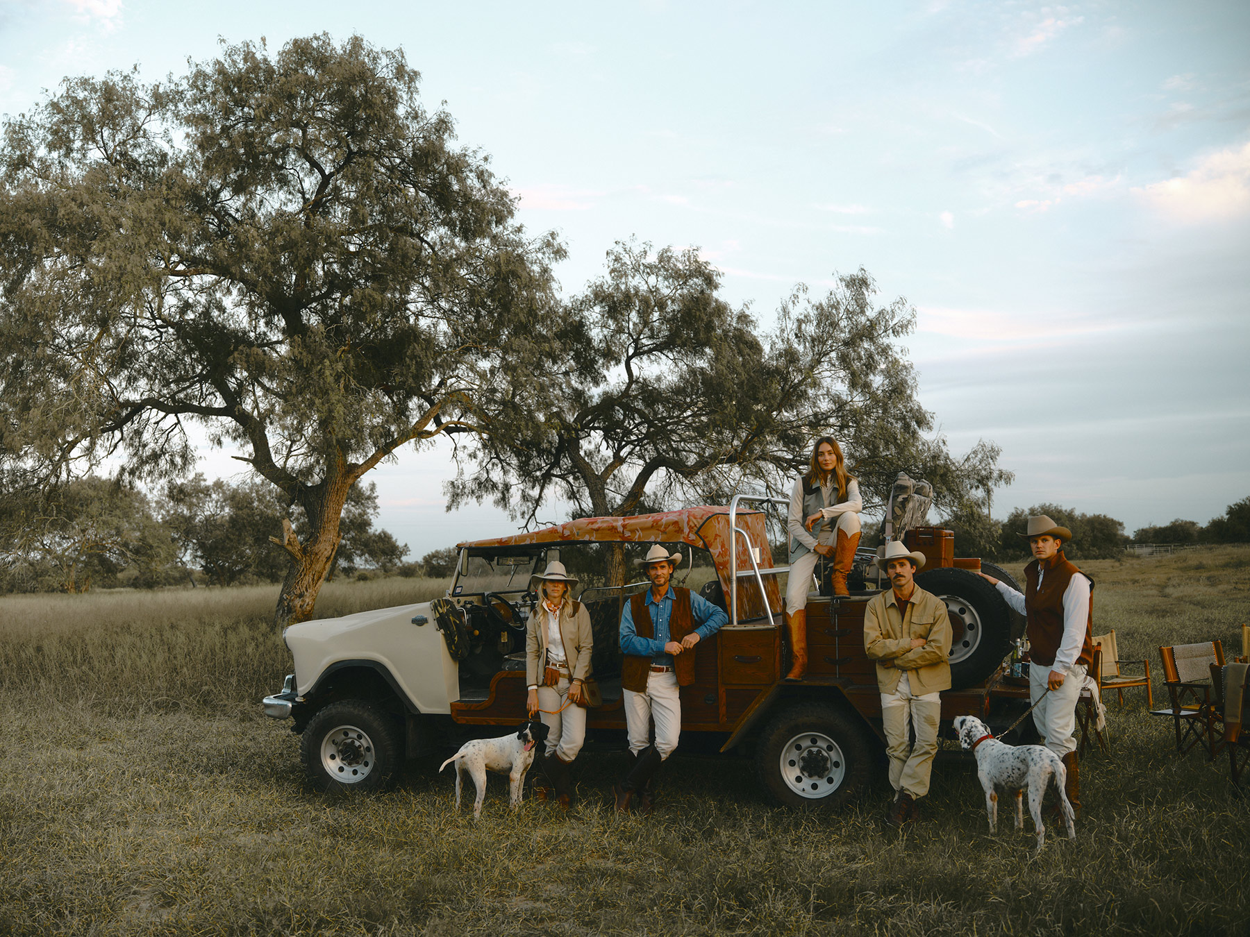 A group portrait of ranchers and hunters for King Ranch Saddle Shop on their ranch in West Texas. Photographed by Travis Gillett