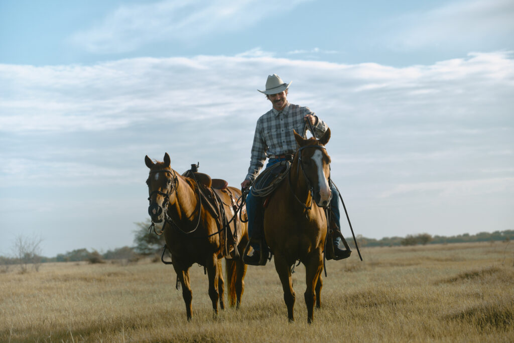A rancher rides his horse on the ranch in this image captured on a Texas ranch by photographer, Travis Gillett.