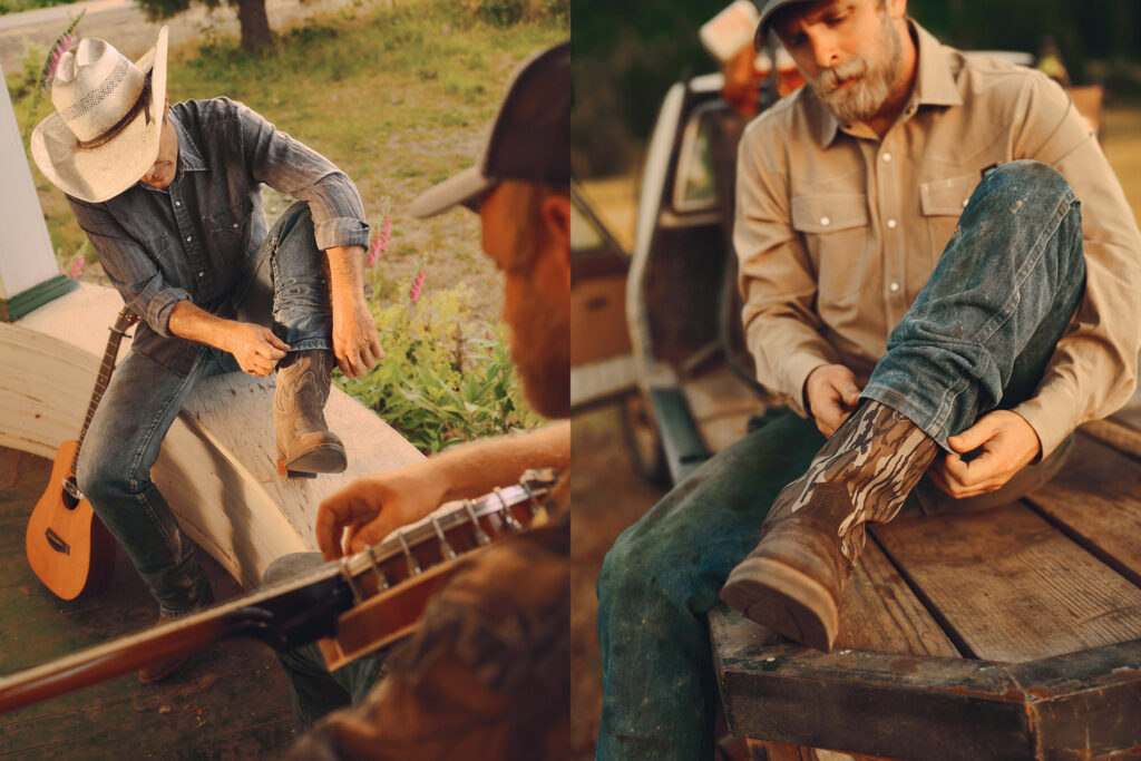Two men with beards and hats put on cowboy boots—one on a porch beside a guitar, the other sitting outdoors by a pickup truck, focused on his footwear. The setting appears rural and relaxed.